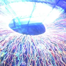 A close-up of the human eye, showing a colorful iris, black pupil, and transparent cornea.